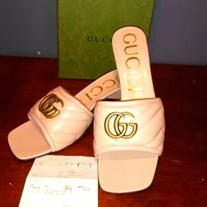 A pair of Gucci sandals
